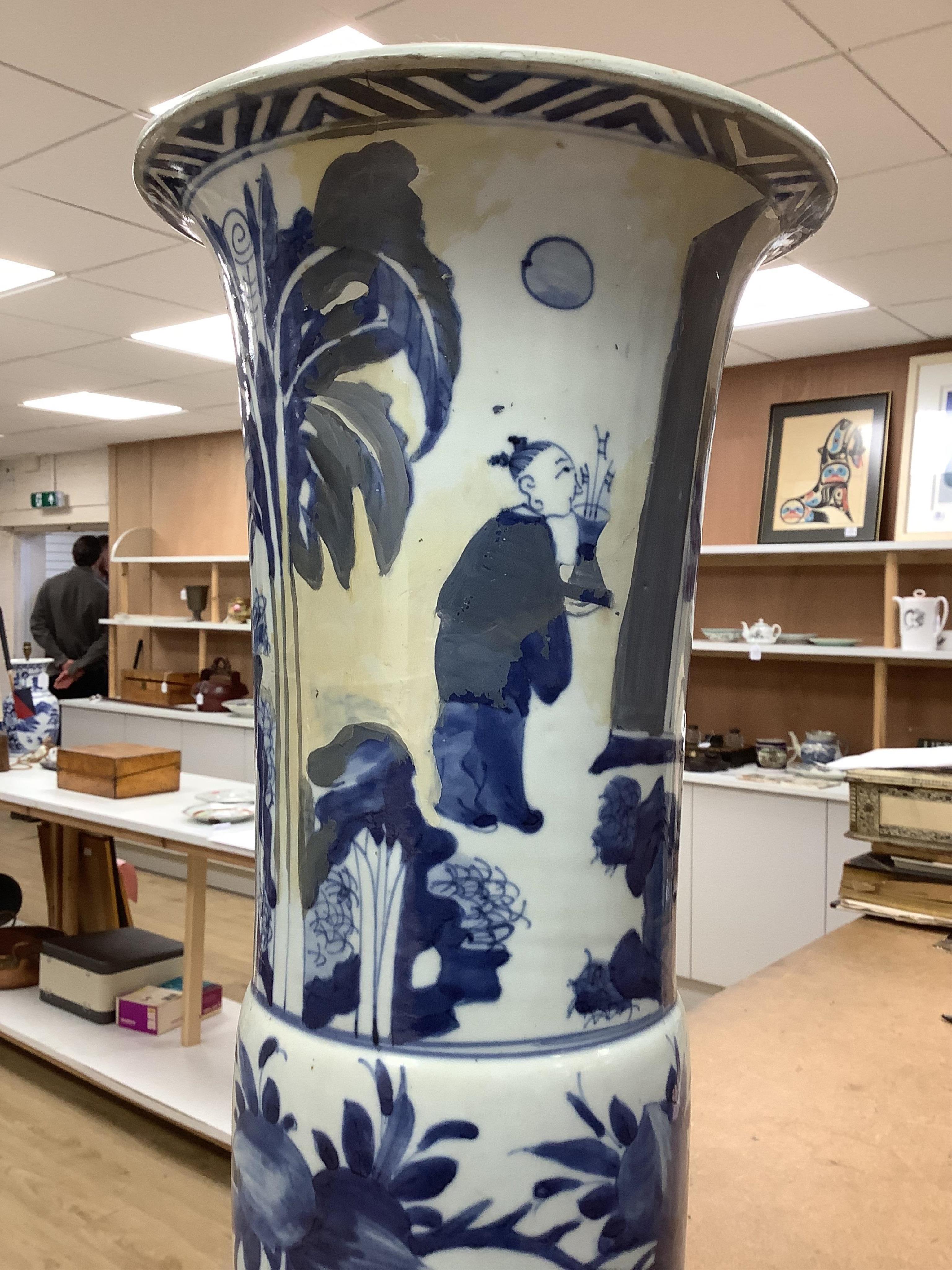 A Chinese blue and white sleeve vase. 53cm high. Condition - heavily restored.